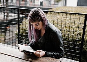 Girl reading a book alone