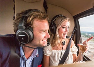 Couple flying in a helicopter