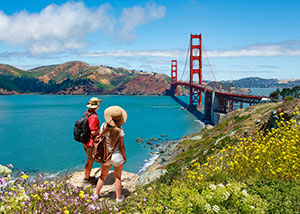 San Francisco Attractions - Couple Overlooking the Golden Gate Bridge