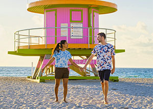 Couple walking along Miami Beach