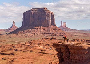 Horse rider overlooking Monument Valley