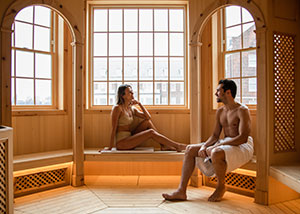Couple relaxing in a sauna 