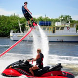 Person on jet ski watching flyboarder