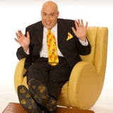 Adam London in chair with duck shoes