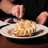 Man cutting banana dessert