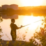 Person dishing at sunset