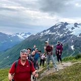 Group Hiking with Mountain in Background