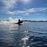 Person catching air on jet ski