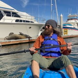 Man on kayak in harbor