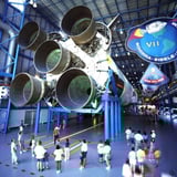 Group looking at space ship
