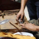 Person rolling cigars