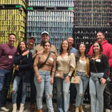 Group in front of beer cans