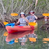 Two people in tandem kayak