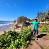 Man on cliff overlooking Oregon Coast