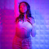 Girl Posing with Purple and Pink Lights
