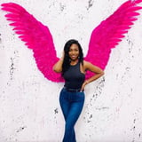 Woman in Front of Pink Wings