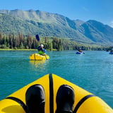 View of Mountains from Raft on Water