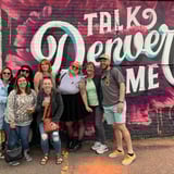 Group in front of wall art