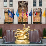Gold statue with flags