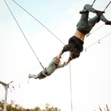 Two people connected on trapeze