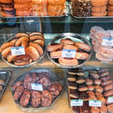 Variety of Donuts in Display Case