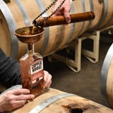 Whiskey being poured into bottle