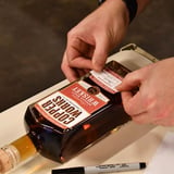 Bottle being labeled