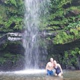 Couple in Waterfall in Rainforest
