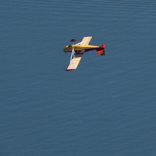 Plane flying over water