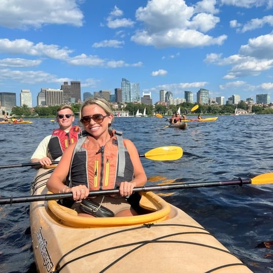 Two people smiling in kayak