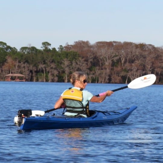 Woman kayaking on water