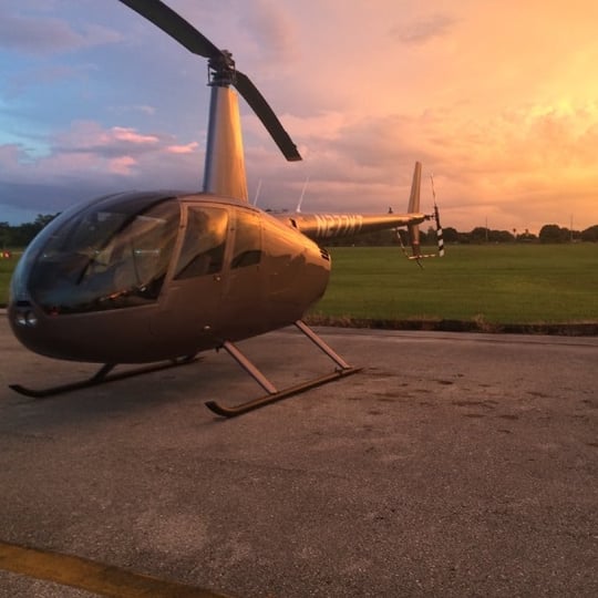 Helicopter on ground at sunset
