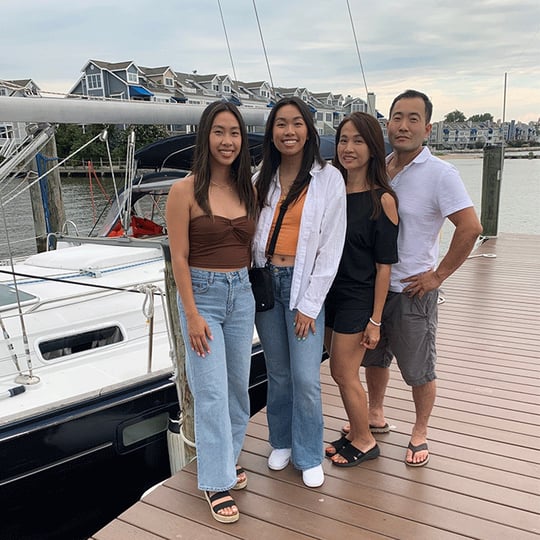 Family in Front of Boat