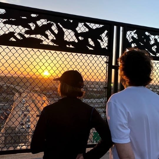 Two men looking at sunset