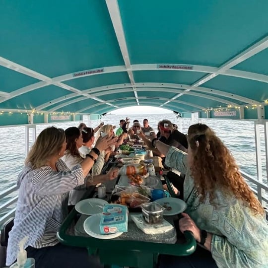 Group on Pedal Boat with Drinks and Food