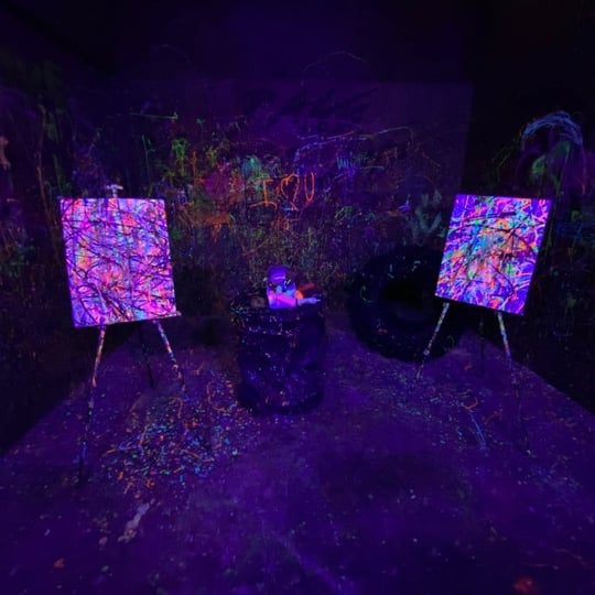 Canvas in Dark Room with Splatter Paint