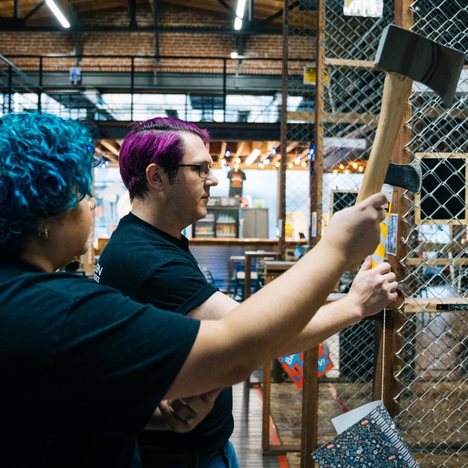 Two People Throwing Axes