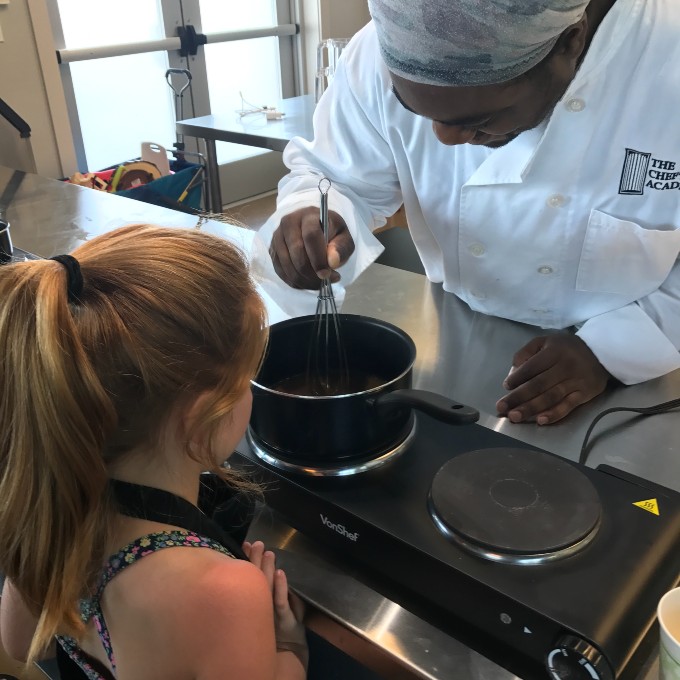 Chef helping kid