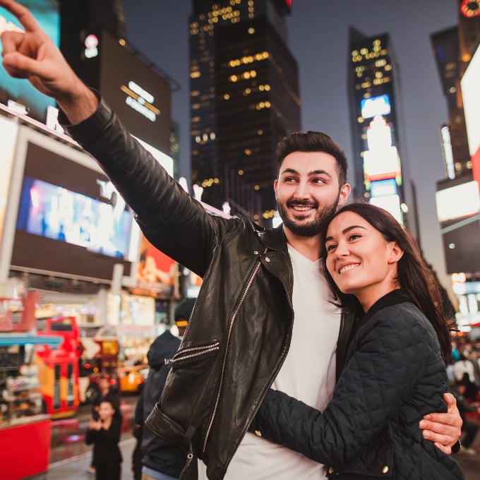 Couple posing in Time Square