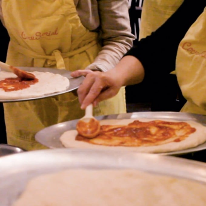 People making pizza