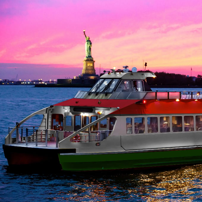 Boat at sunset with Statue of Liberty