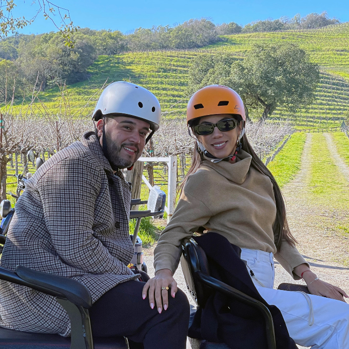 Couple on trike by vineyard