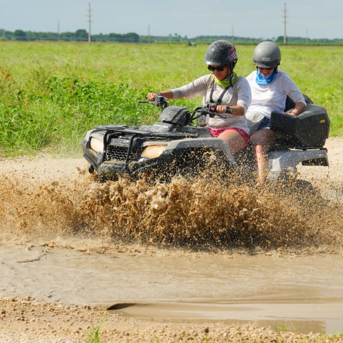 ATV riding through mud