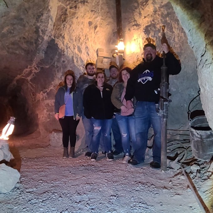 Group Posing in Gold Mine
