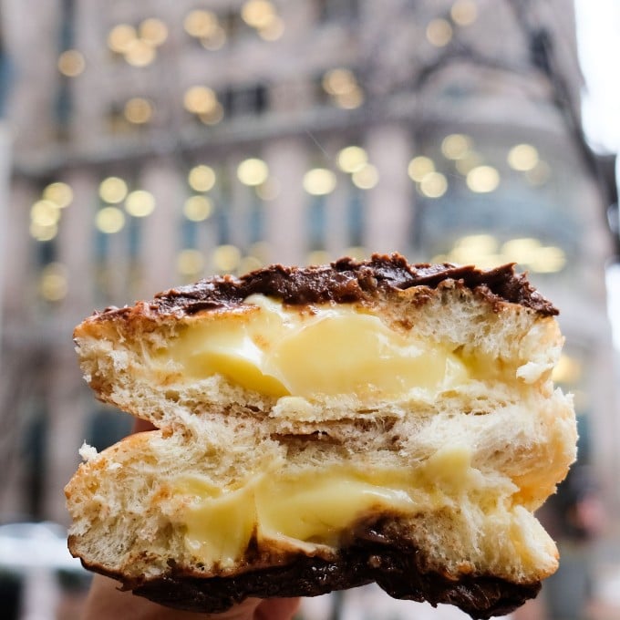 Cream Filled Donut in Front of Building