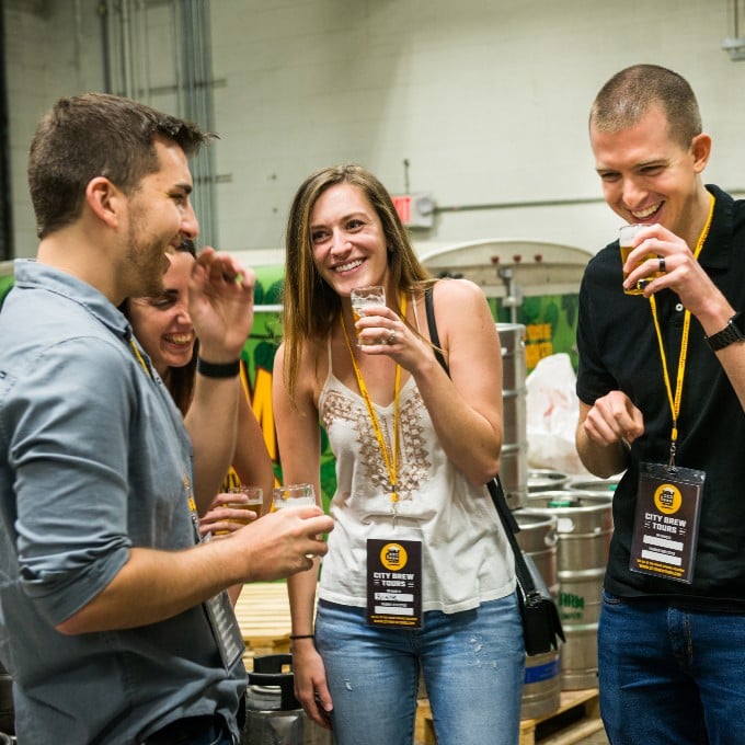 Three people drinking beers