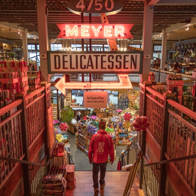 Man Walking in Delicatessen 