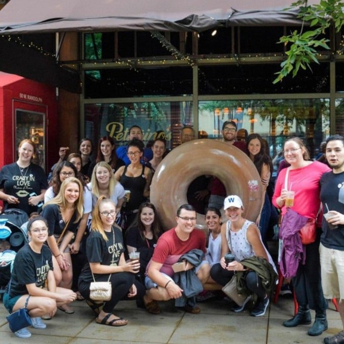 Group Posing with Donut Statue