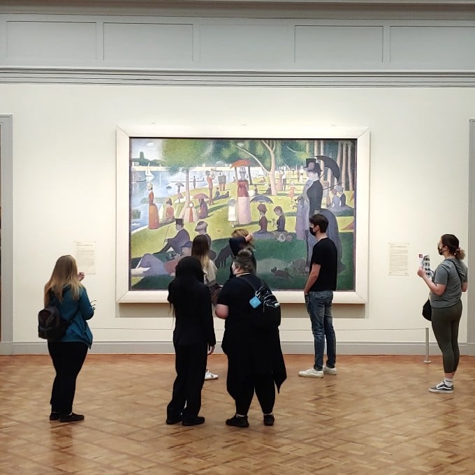 Group in Front of Painting