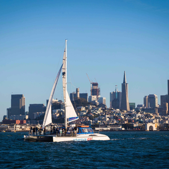 Boat sailing near city